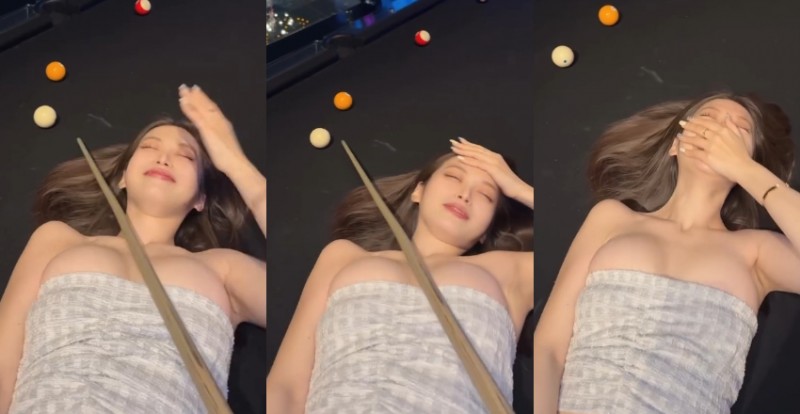 巨乳女神躺桌成為人體架桿器　超穩手感一桿進洞不是問題